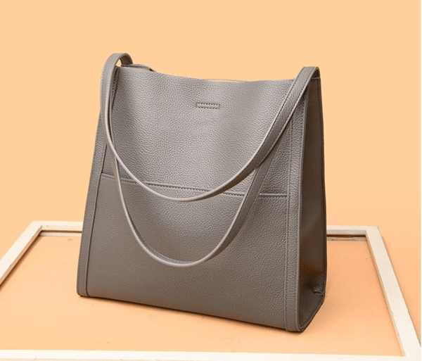 Genuine leather shoulder bag in solid and simple colours